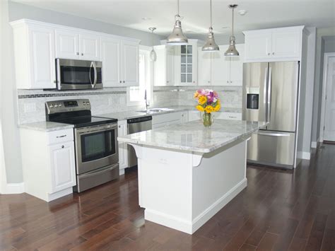 kgalley kitchen white cabinet stainless steel appliances light marble countertop|modern white galley kitchen.